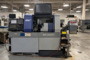 CNC lathe and chip conveyor in workshop (Custom)